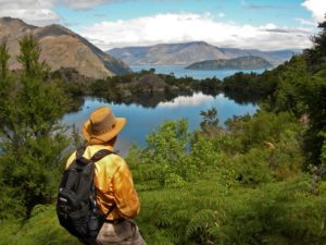 Man in hat enjoying view on Lake Wanaka Cruise & Island Nature Walk